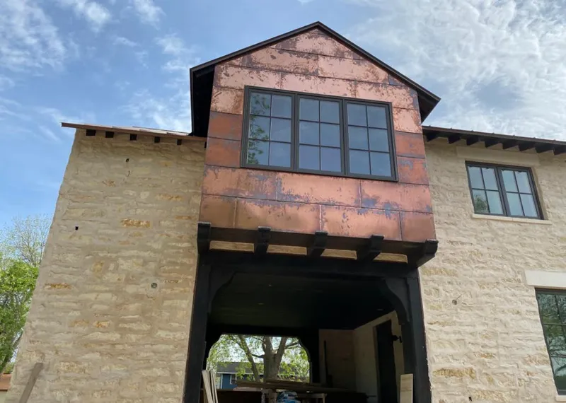 Copper metal panel facade on a stone building for Metal Roof Coating in Lihue