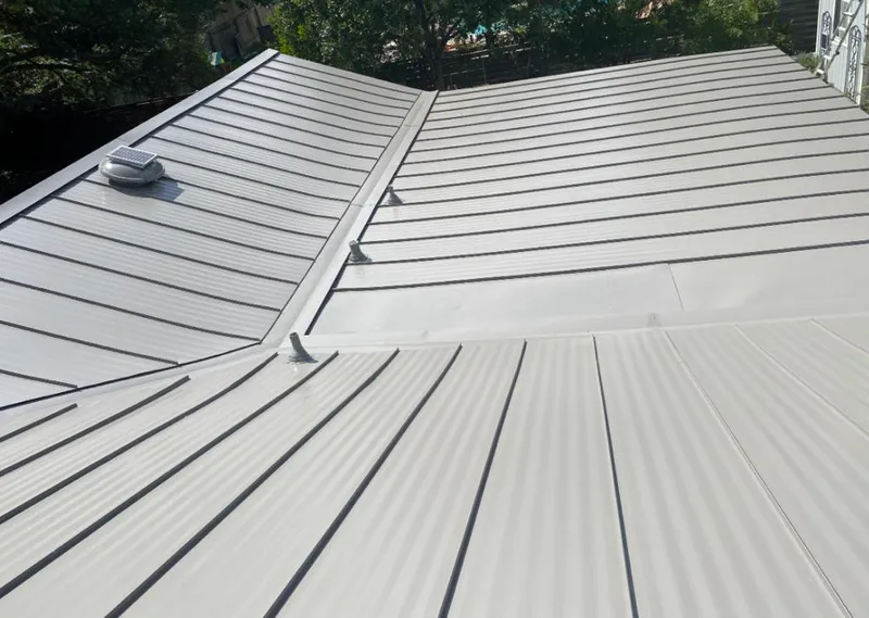 Solar attic fan installed on a metal roof for Roof Ventilation in Lihue